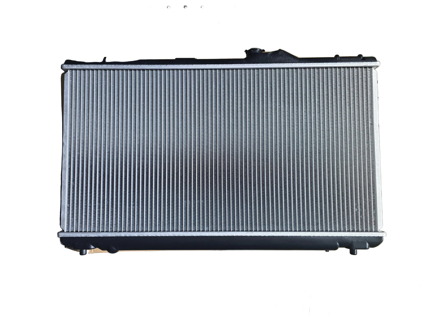 KRA20382 Car radiator on a pegboard background