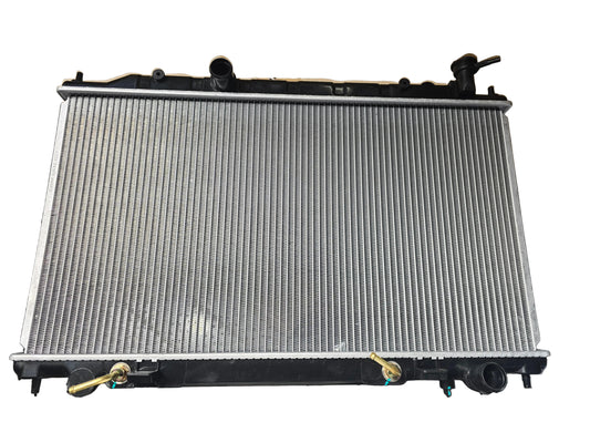 Kra10192 Car radiator on a black surface with cardboard box in the background