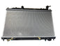 Kra10192 Car radiator on a black surface with cardboard box in the background